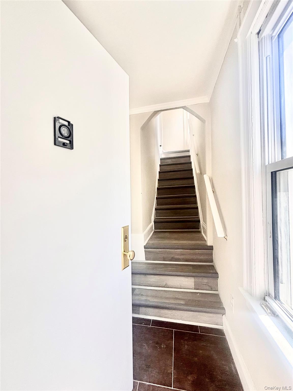 66 Kenmore Road Valley Stream, NY 11581 - Photo 3 of 15 Staircase beyond the entrance door.