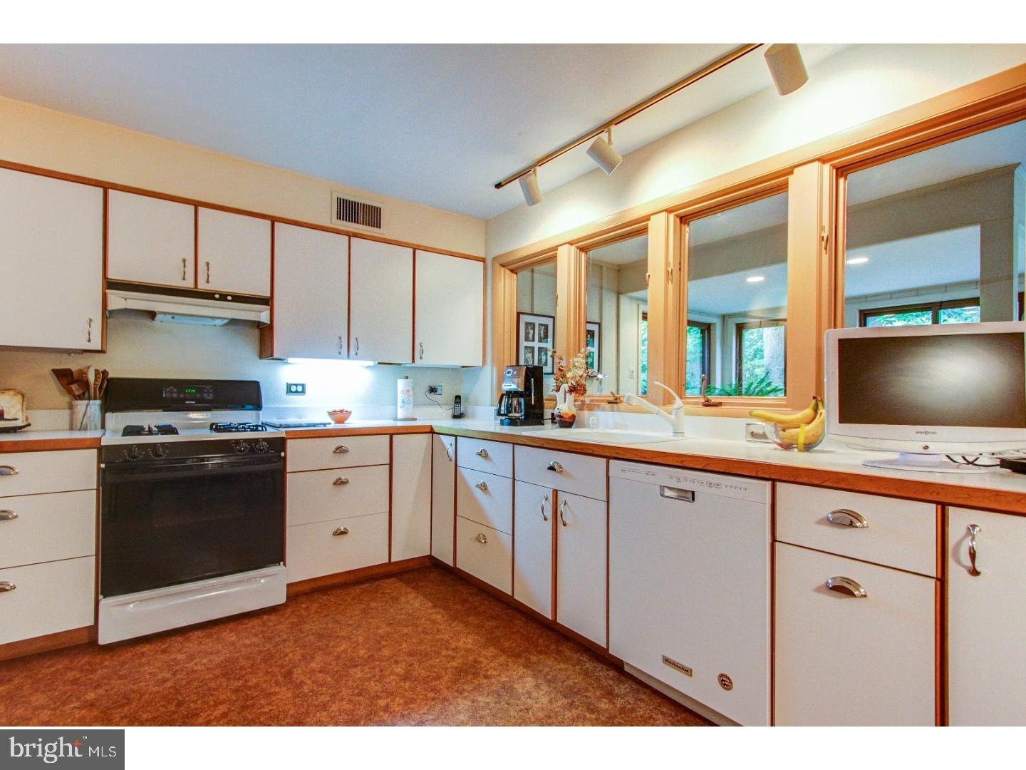 1008 Delene Road Rydal, PA 19046 - Photo 7 of 24 a kitchen with granite countertop a sink stainless steel appliances and cabinets