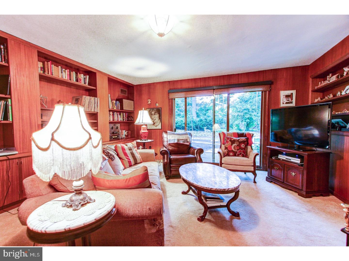 1008 Delene Road Rydal, PA 19046 - Photo 9 of 24 a living room with furniture a flat screen tv and a large window