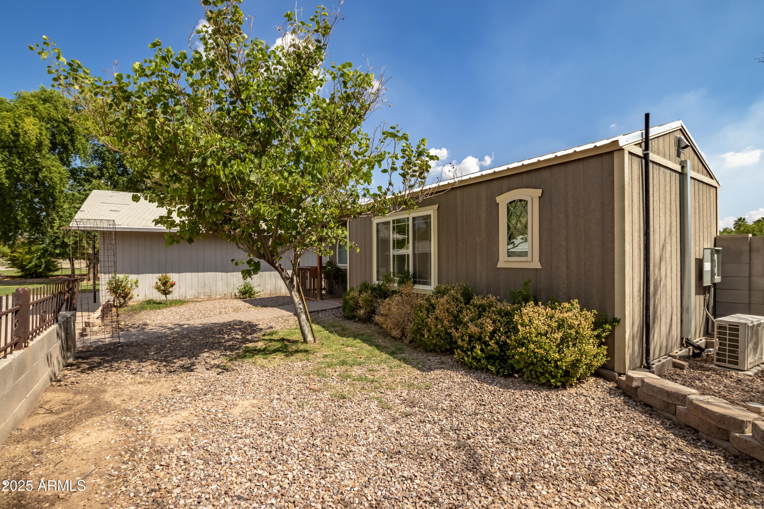 12417 East Cloud Road Chandler, AZ 85249 - Photo 15 of 40 a backyard of a house with flower plants