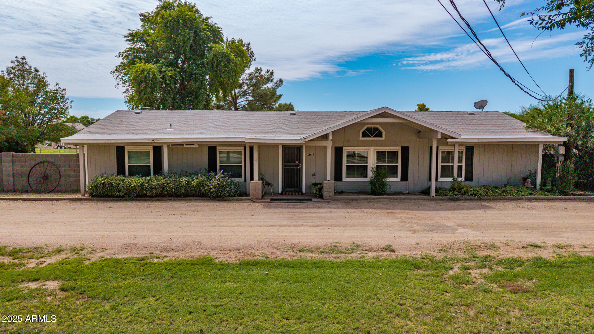 12417 East Cloud Road Chandler, AZ 85249 - Photo 2 of 40 a front view of a house with a garden
