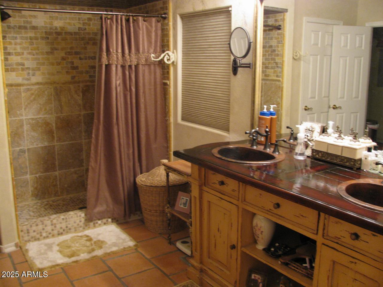 12417 East Cloud Road Chandler, AZ 85249 - Photo 35 of 40 a bathroom with a sink and a mirror