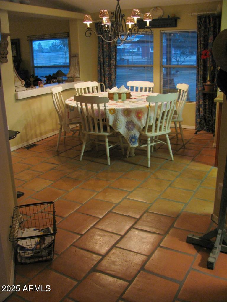 12417 East Cloud Road Chandler, AZ 85249 - Photo 36 of 40 a view of a patio with table and chairs with wooden floor