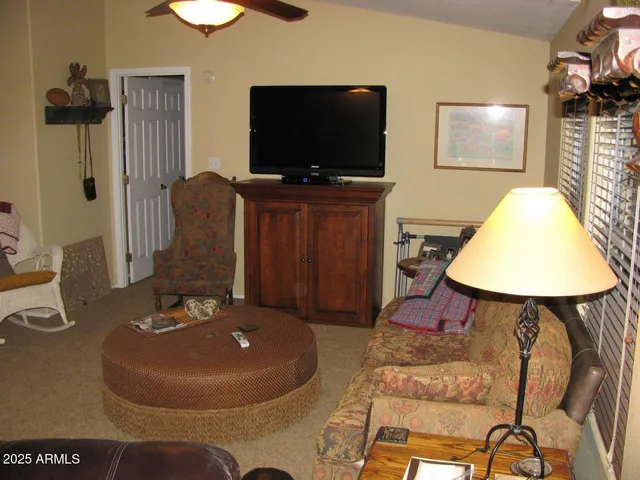 a kitchen with stainless steel appliances cabinets a table and chairs