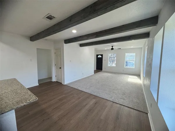 a view of an empty room and window