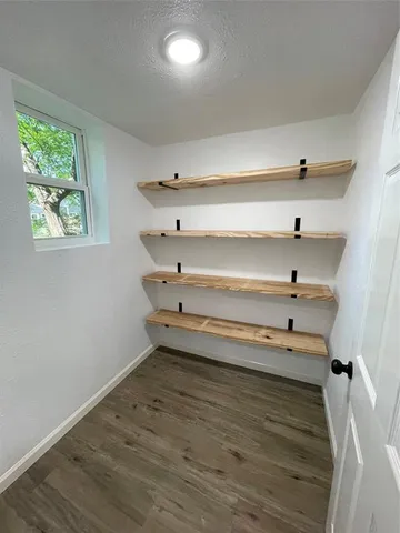 a view of storage and utility room with empty racks