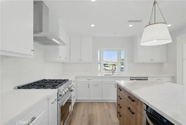 a stove top oven sitting inside of a kitchen
