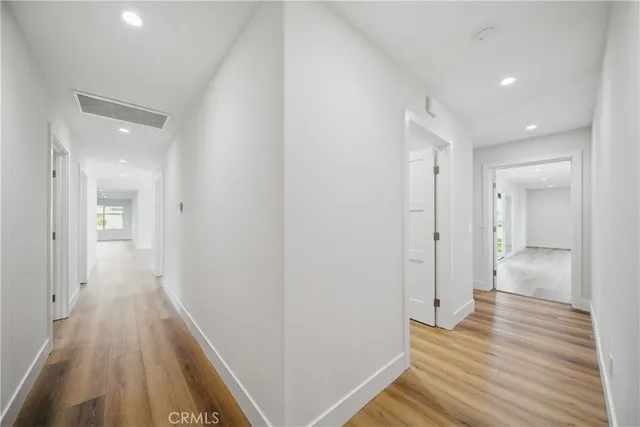 a view of room with wooden floor and window