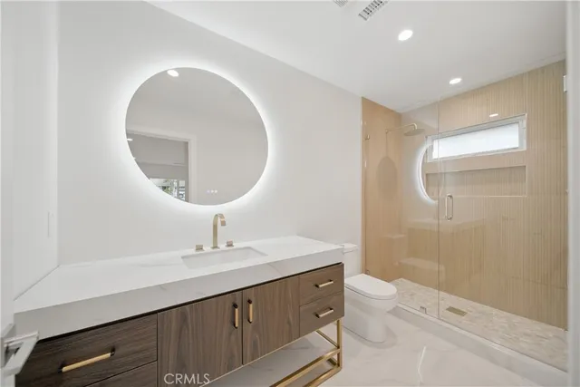 a spacious bathroom with a bathtub and shower