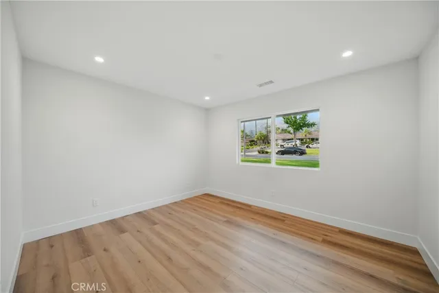 a view of a park with large trees