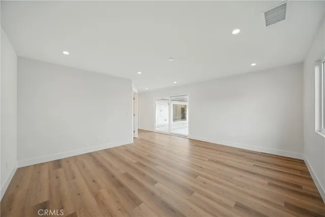 an aerial view of residential houses with outdoor space and parking