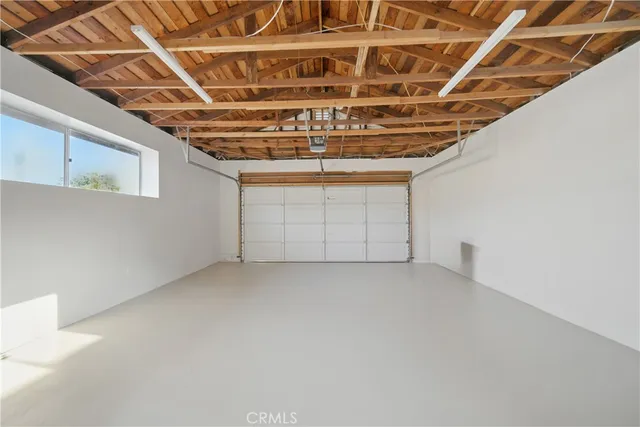 a view of a swimming pool with lounge chairs in patio