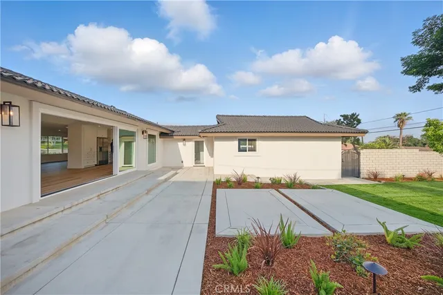 an aerial view of a house with a garden