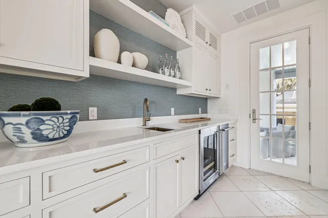 a stove top oven sitting inside of a kitchen