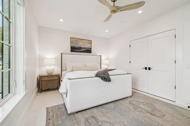 a view of a balcony with wooden chairs