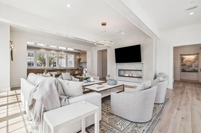 a bathroom with a sink a potted plant and a toilet