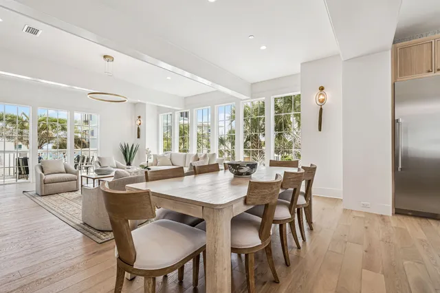 a view of a balcony with wooden chairs