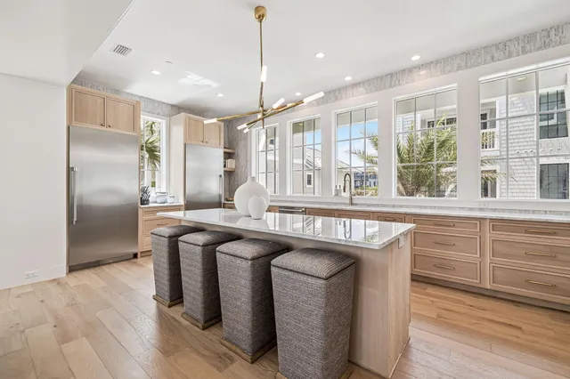 a spacious bathroom with a double vanity sink mirror and bathtub