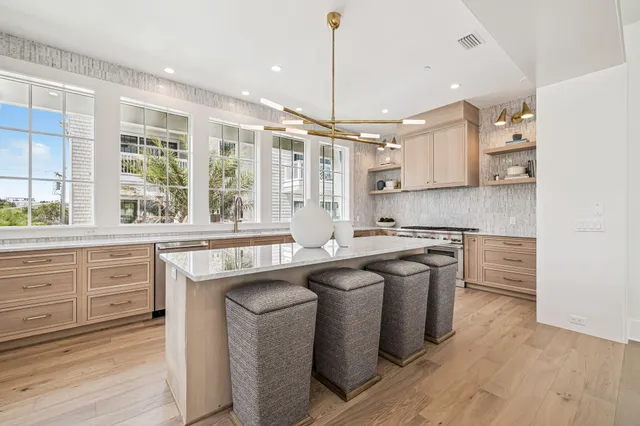 a view of a room with rack on the wall and a large window