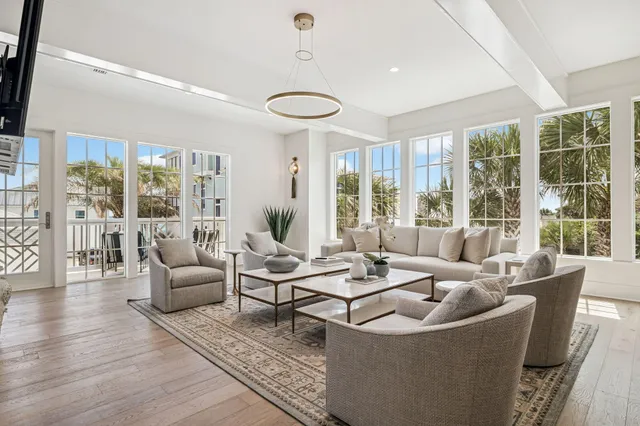a view of a dining room with furniture and a window