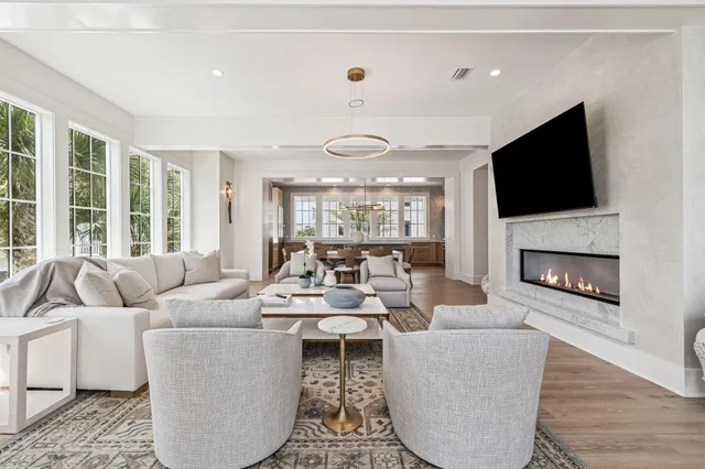 a living room with a large window and table