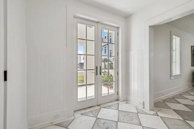 a bedroom with a large bed and a flat screen tv