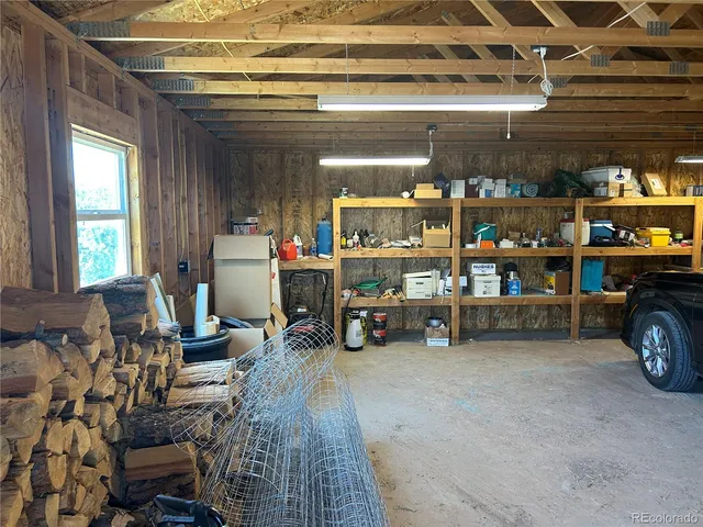 a view of a children room with furniture and a window