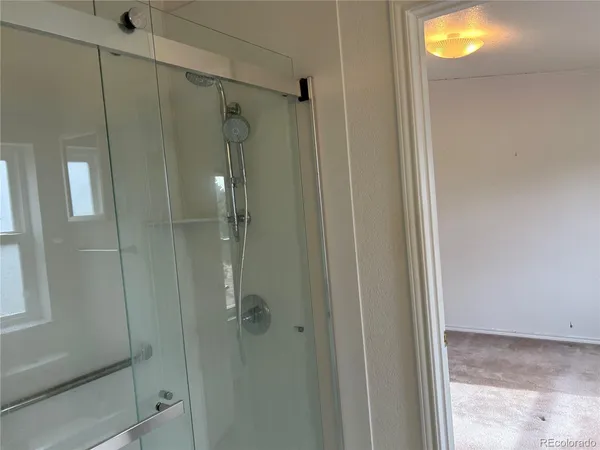 a view of an empty room and window