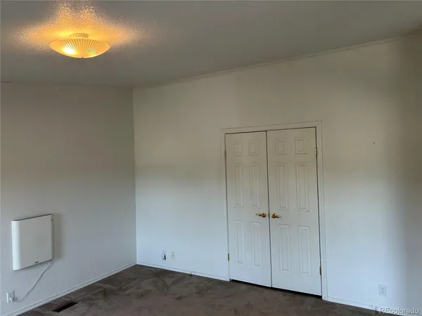a kitchen with stainless steel appliances granite countertop a refrigerator and a stove