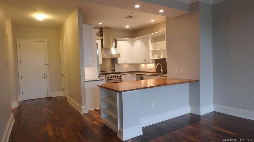 75 Stone Ridge Way, Unit 3E Fairfield, CT 06824 - Photo 22 of 23 Enter into an open floor plan apartment with gourmet kitchen with stainless steel Viking Appliances