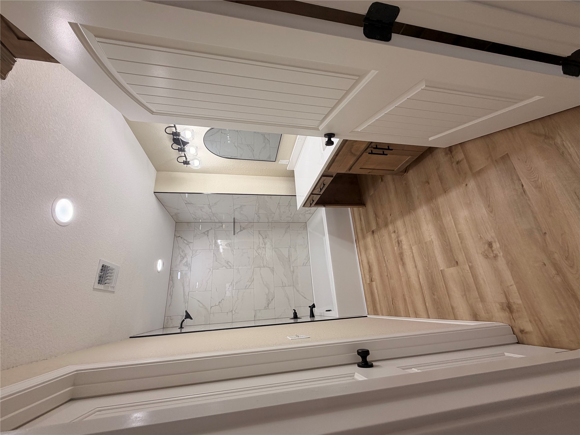 2915 East 2090 Road, Unit LOT 1 Hugo, OK 74743 - Photo 17 of 28 Wood-finish flooring, recessed lighting, and a vanity with a white countertop