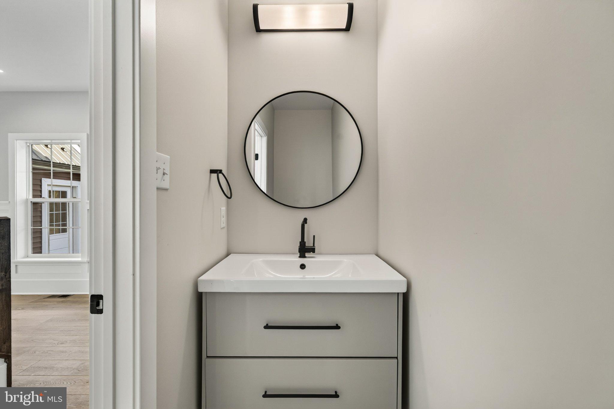 2069 Dutton Mill Road Newtown Square, PA 19073 - Photo 17 of 70 Sleek modern bathroom with circular mirror.