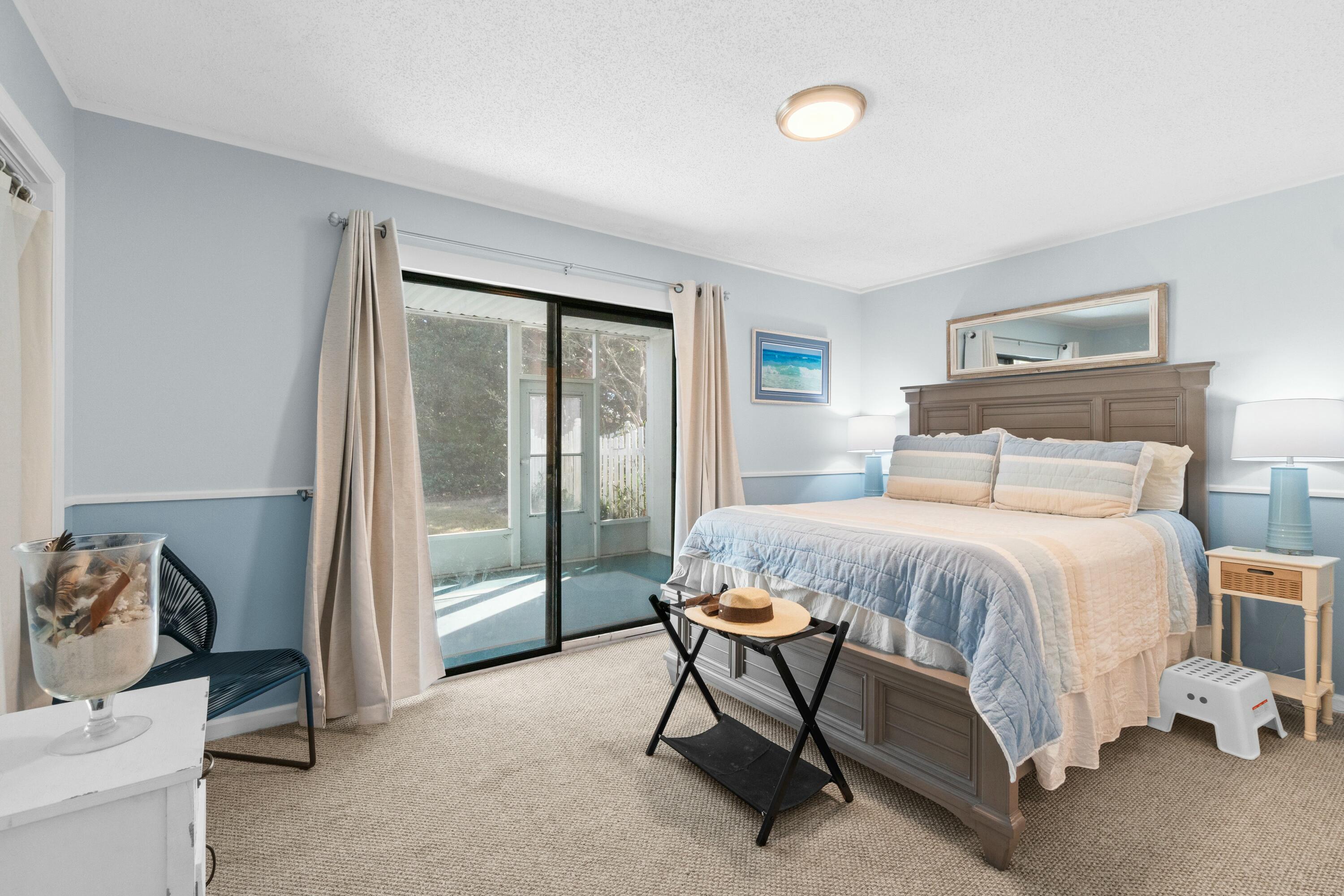 50 Gossamer Lane, Unit 12 Inlet Beach, FL 32461 - Photo 22 of 37 a bedroom with a bed and a mirror