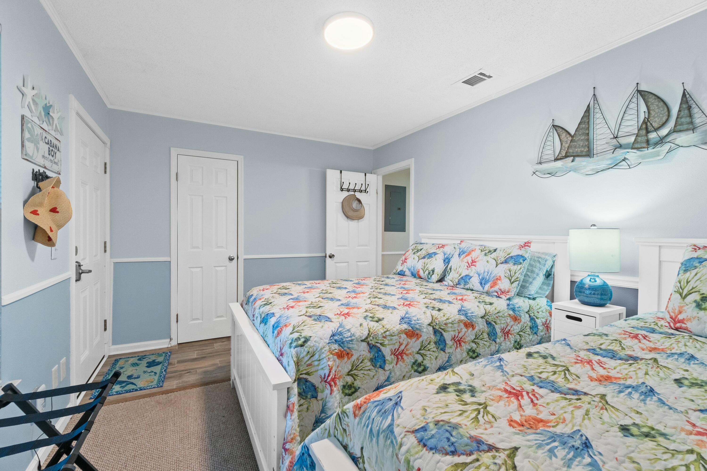 50 Gossamer Lane, Unit 12 Inlet Beach, FL 32461 - Photo 28 of 37 a bedroom with a bed and painting on the wall