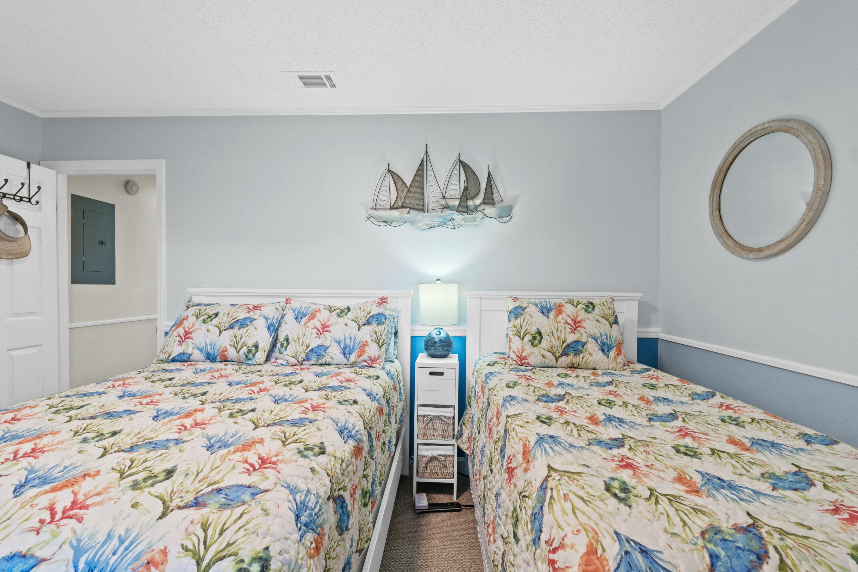50 Gossamer Lane, Unit 12 Inlet Beach, FL 32461 - Photo 29 of 37 a bedroom with two beds and painting on the wall