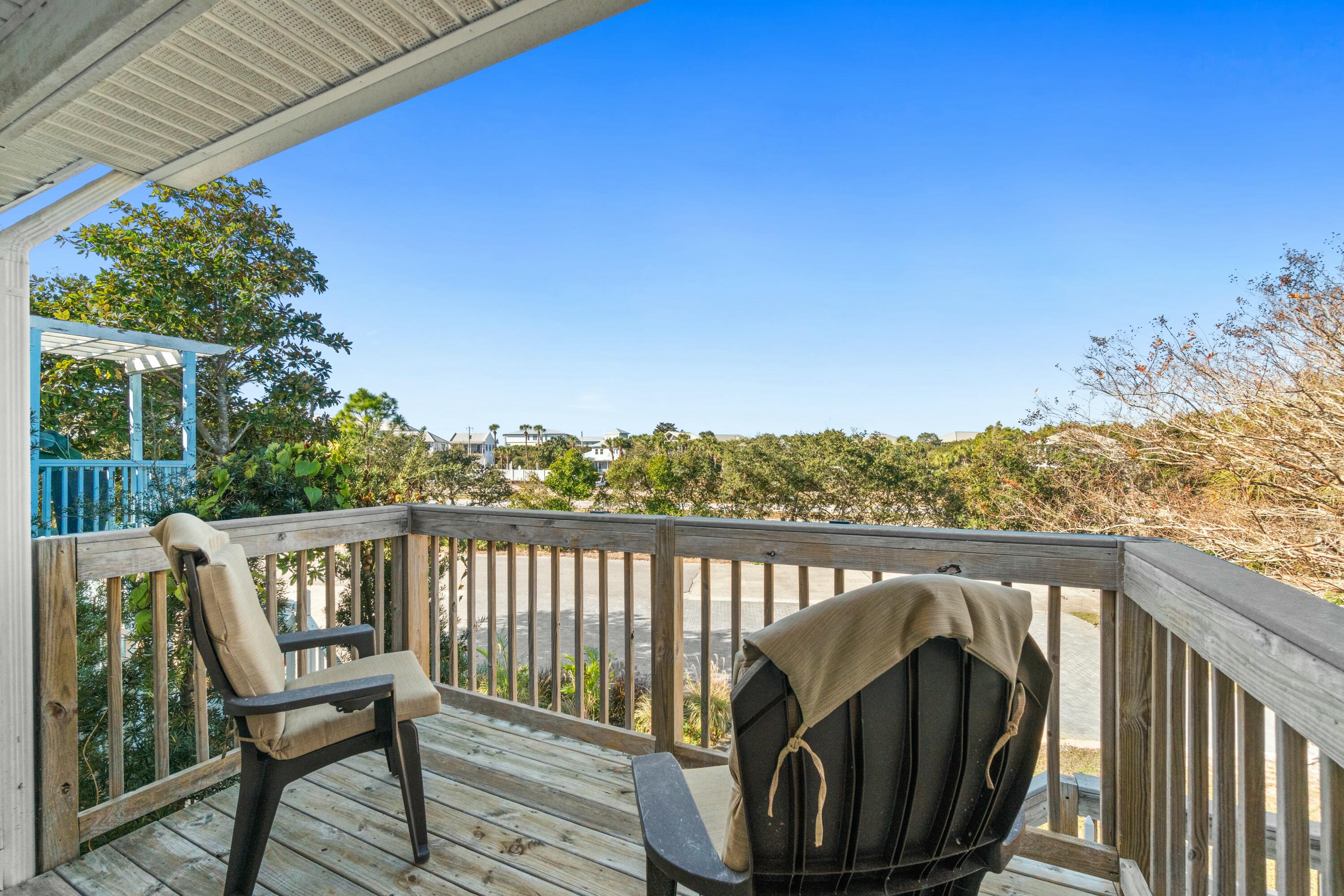 50 Gossamer Lane, Unit 12 Inlet Beach, FL 32461 - Photo 6 of 37 a view of a two chairs in the balcony