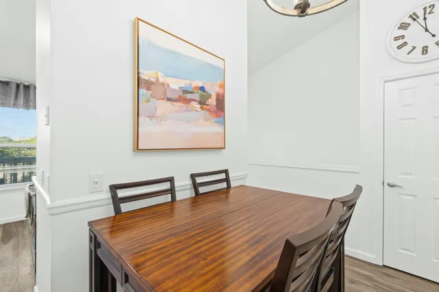 a dining room with a table and chairs