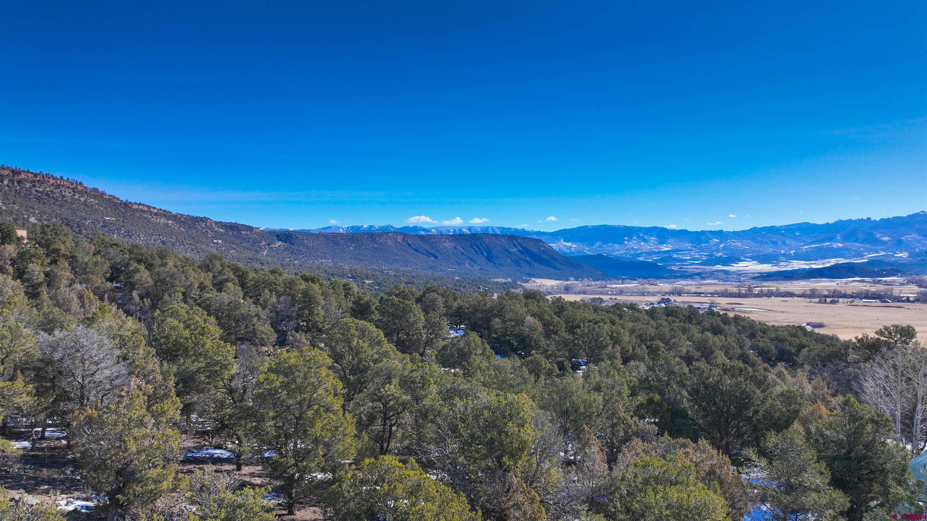 2461 Pleasant Point Drive Ridgway, CO 81432 - Photo 7 of 20 a view of a city with sunset
