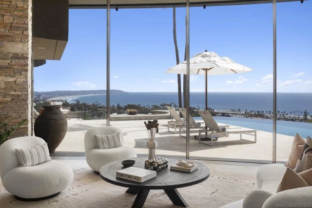 a view of a chairs and table in patio with a yard