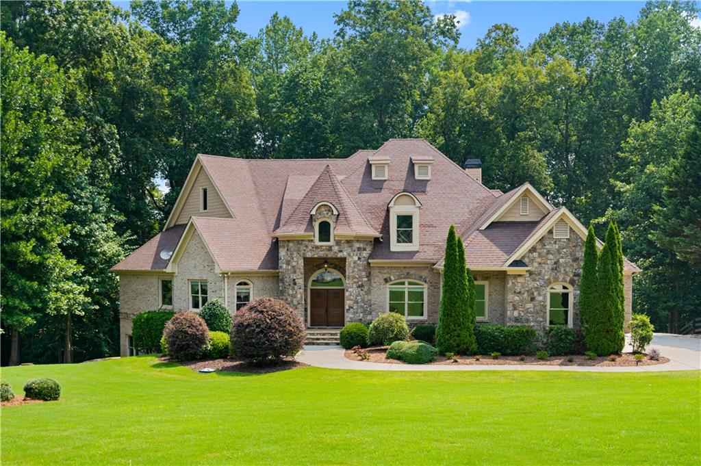 408 Addie Lane Canton, GA 30115 - Photo 1 of 1 a front view of a house with a yard and garage