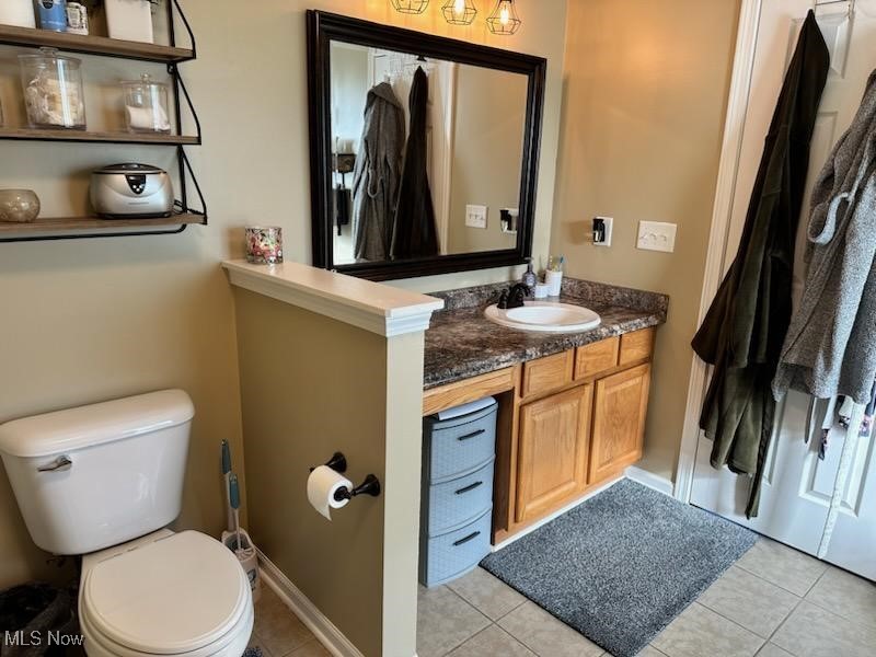 2761 Omega Road Greenwich, OH 44837 - Photo 44 of 50 Bathroom featuring vanity, toilet, and tile patterned flooring