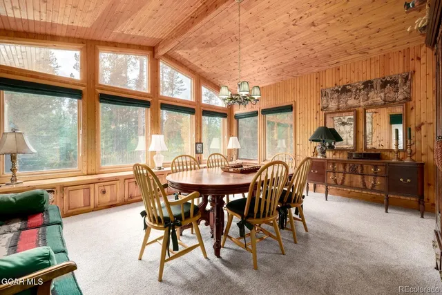 a kitchen with stainless steel appliances granite countertop a sink a refrigerator and a stove