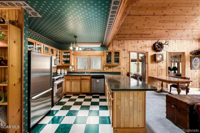 a kitchen with lots of appliances and cabinets