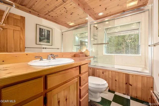 a balcony with hardwood filled with furniture