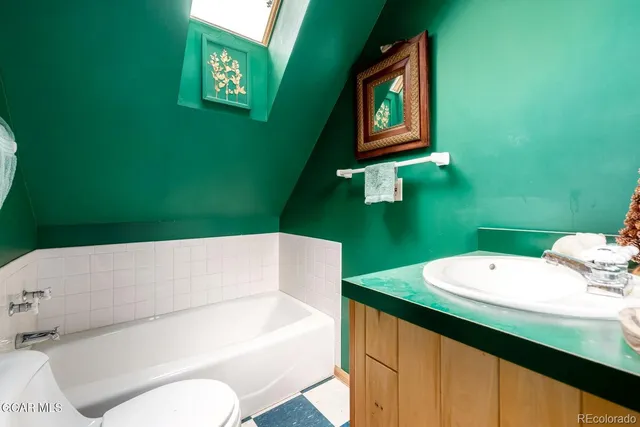 a view of a livingroom with workspace and a furniture