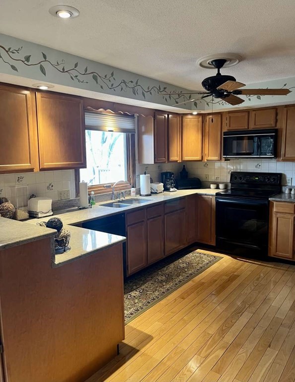 57 Chestnut Circle Suffield, CT 06093 - Photo 17 of 40 a kitchen with stainless steel appliances granite countertop a sink dishwasher stove and refrigerator