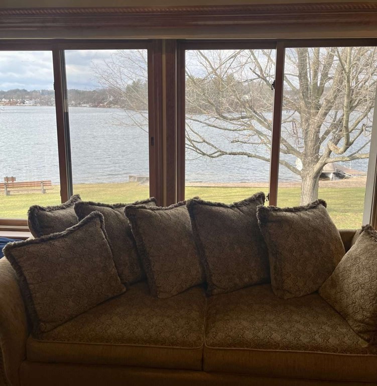 57 Chestnut Circle Suffield, CT 06093 - Photo 21 of 40 a living room with large windows and a table