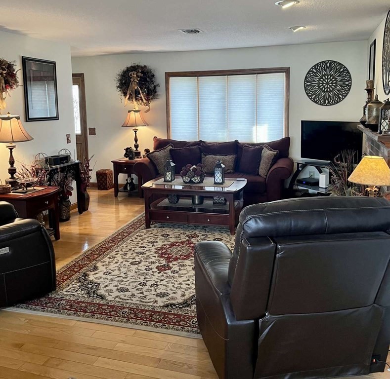 57 Chestnut Circle Suffield, CT 06093 - Photo 28 of 40 a living room with furniture wooden floor and a window