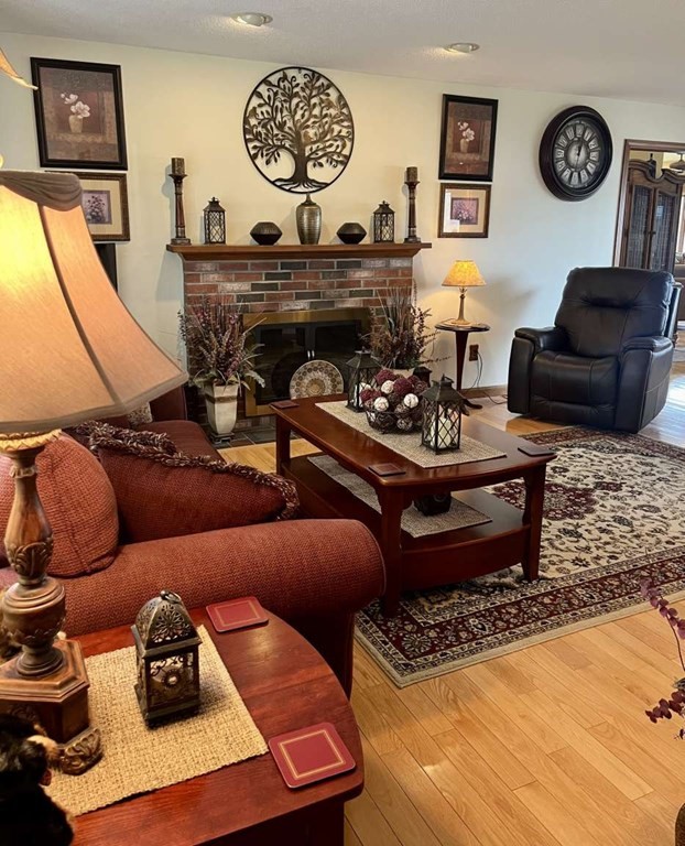 57 Chestnut Circle Suffield, CT 06093 - Photo 29 of 40 a living room with furniture and a wooden floor