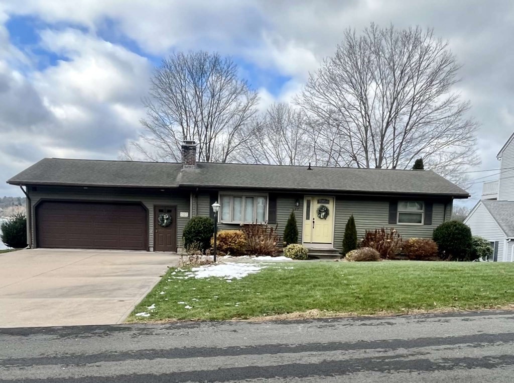 57 Chestnut Circle Suffield, CT 06093 - Photo 3 of 40 a front view of a house with garden